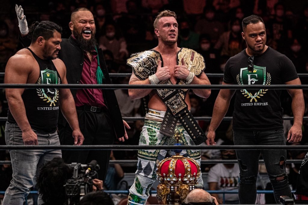 Will Ospreay, Great-O-Khan, Jeff Cobb and Aaron Henare - The United Empire with Ospreay holding the IWGP World Heavyweight Championship, the RPW British Heavyweight Championship and the New Japan Cup Trophy