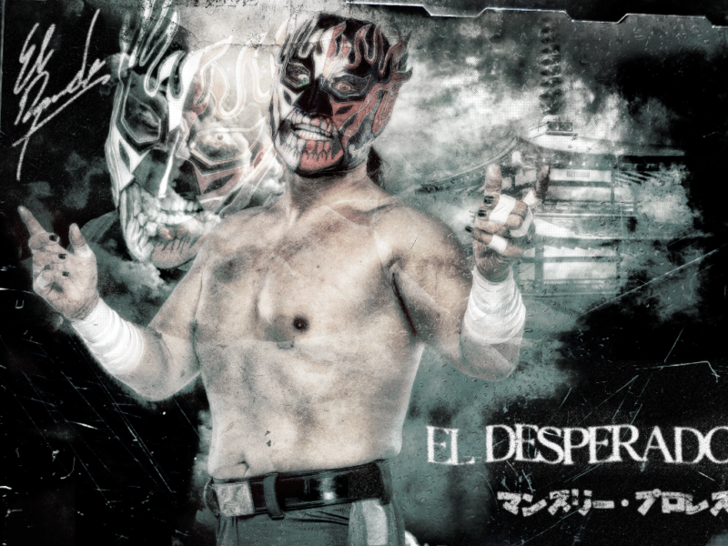 Masked, shirtless professional wrestler with a skull-like mask giving a double thumbs up.