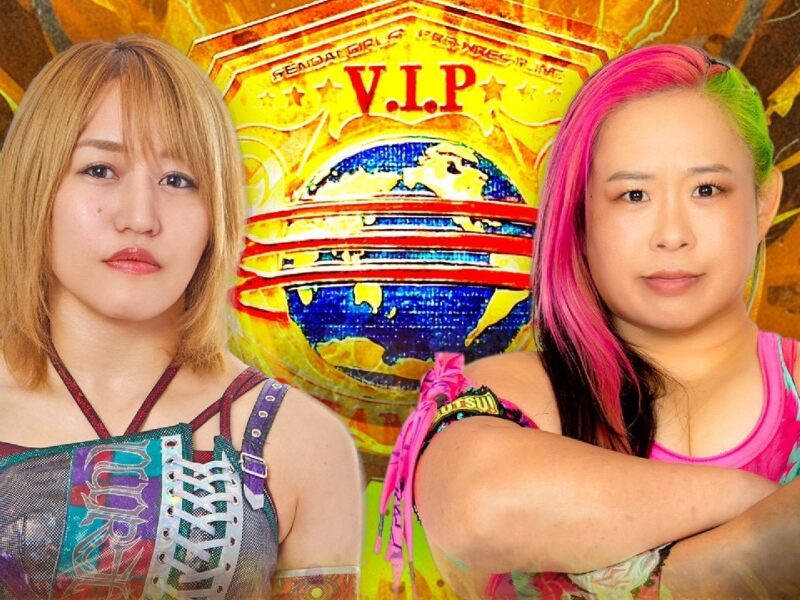 Two female wrestlers pose side by side in bright, patterned outfits against a fiery orange backdrop with a VIP globe banner behind them.
